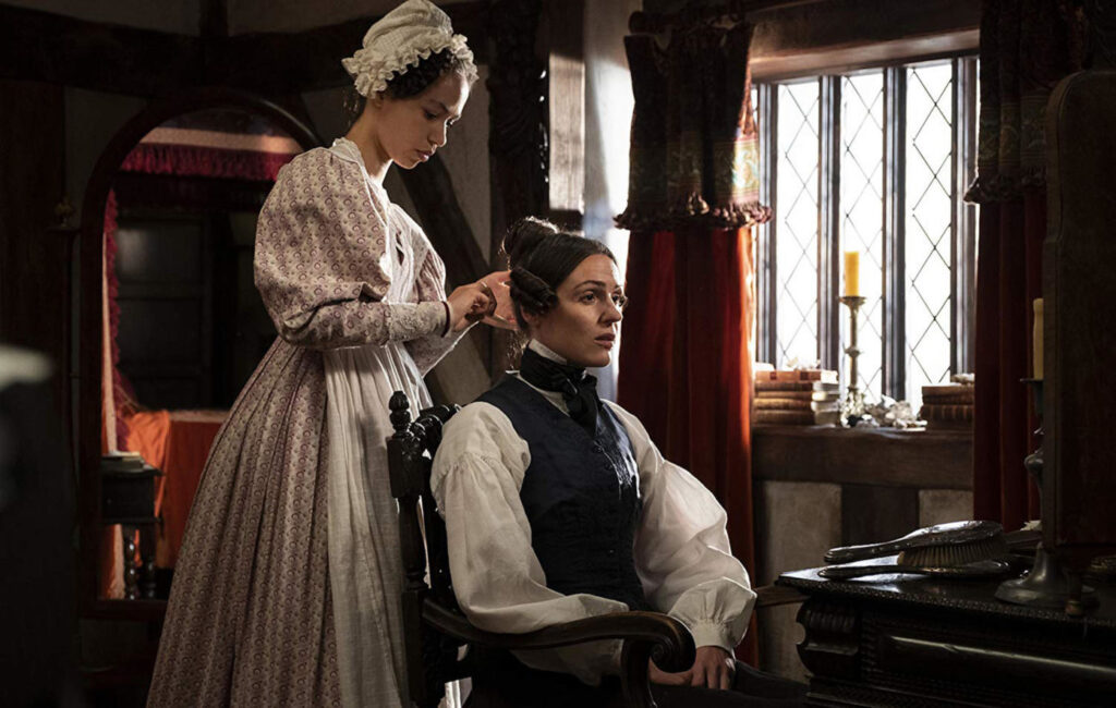 A servant assists Anne Lister with her morning toilet in Gentleman Jack.